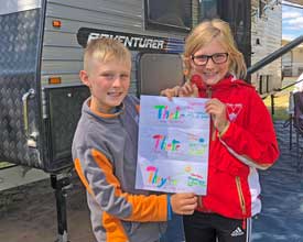 Tommy and Stella with an example of their 'homework'