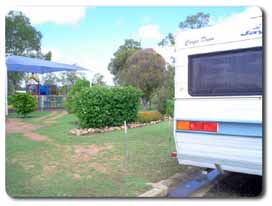Caravan parked alongside gardens at Mulgildie rest area