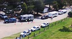 Caravans line up for weight checks at the Princes Hwy's Newmerella rest area